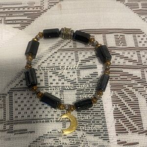 Elegant Black and Gold Crescent Bracelet